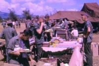 Thanksgiving 1965, with cook sergeant, Jerry Nobles, with cigar